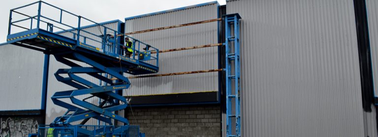 Working on site refurbishing cladding
